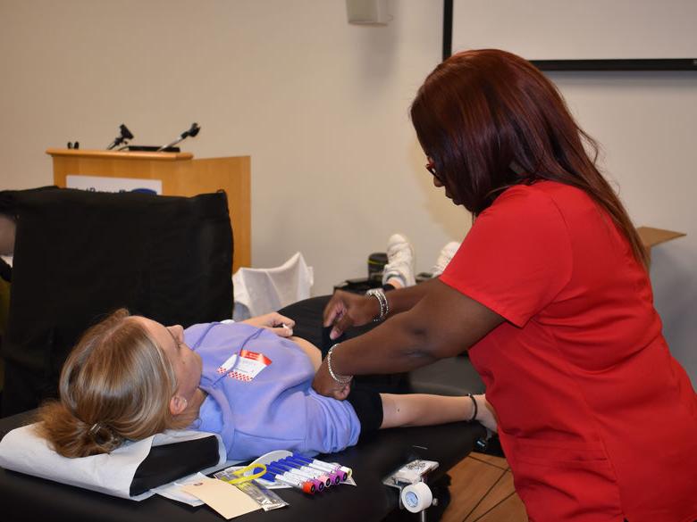 Penn State Abington (near Philadelphia) student laying on table about to get blood taken